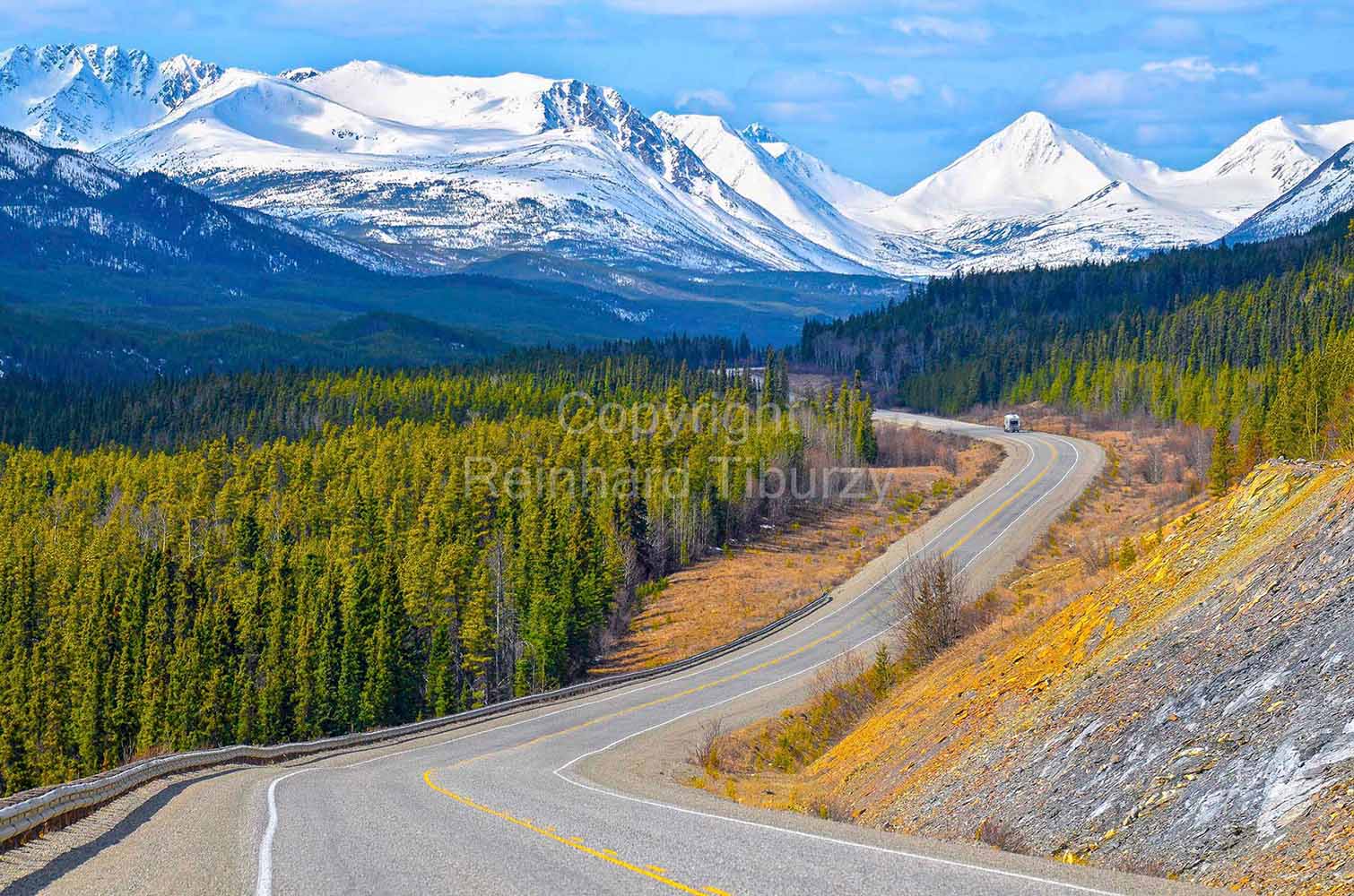 Alaska_Highway_Yukon_Canada_snow covered_mountains_conifer_woods
