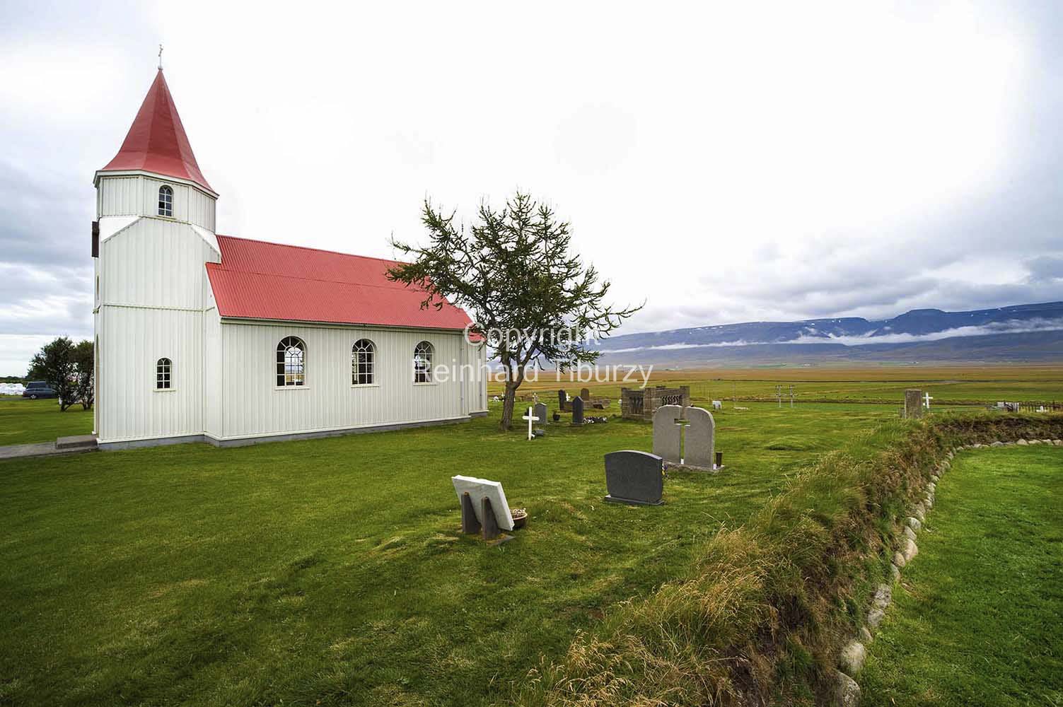 Glaumbaejarkirkja, church of Glaumbaer, northern Iceland, surrounded by old gravestones