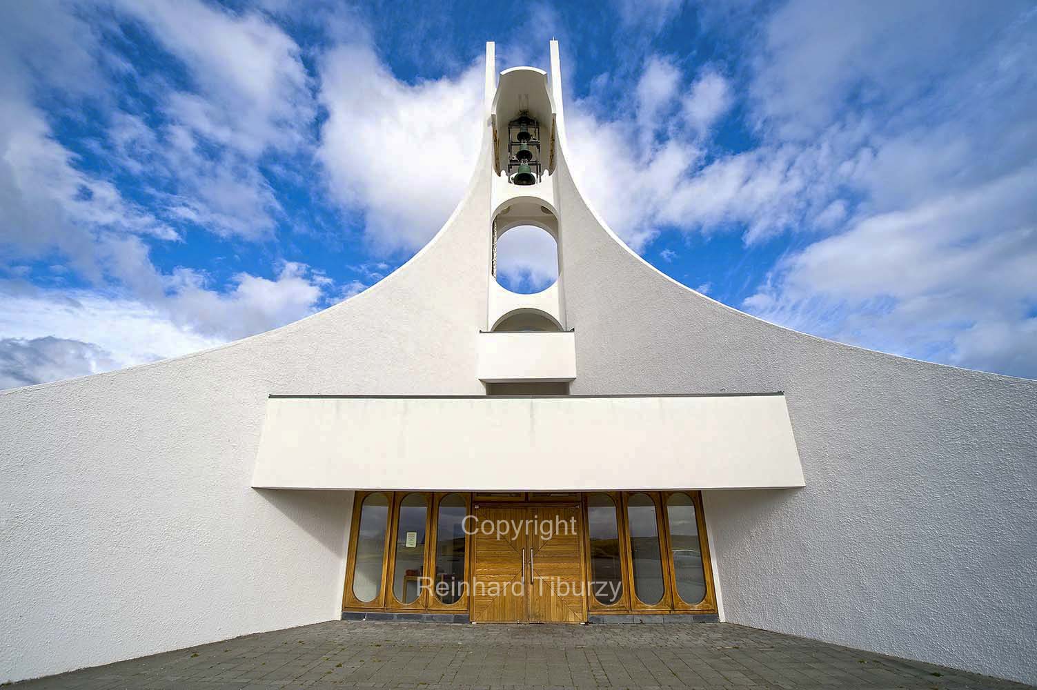 The Stykkisholmskirkja, designed by Jon Haraldsson, is a modern white church at Stykkisholmur. Consecrated 1990